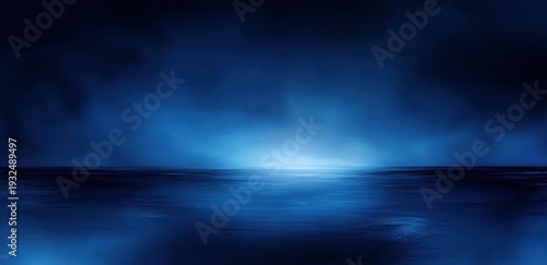 Tranquil deep blue seascape with glowing horizon and misty sky evoking calm and solitude