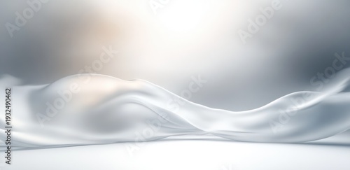 white silky fabric waves flowing across a smooth surface with soft gradient light, serene elegant and airy atmosphere