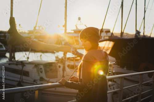 girl at sunset in the harbour