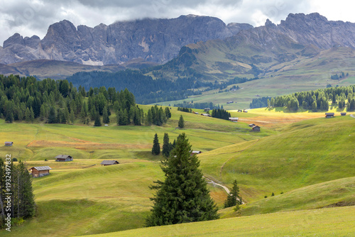 Sassolungo peaks above Alpe di Siusi alpine meadows in the Dolomites, Italy