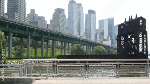 New York City Riverside Park South Manhattan United States. Modern residential building Upper West Side. Urban skyscraper skyline. Miller highway remnant, elevated viaduct. Industrial gantry dock pier