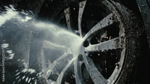 Wallpaper Mural Close-up of a dirty car wheel being sprayed with water during a wash Torontodigital.ca