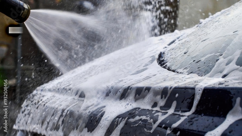 Wallpaper Mural Close-up of a car being washed with foamy soap and water spray Torontodigital.ca