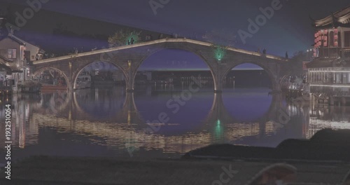 Serene Night View of a Modern Bridge with Reflections in Waterway. Zhujiajiao, Shanghai, China