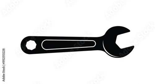 A black wrench tool depicted in a stark contrasting silhouette