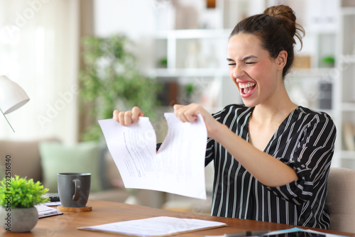 Happy self employed breaking paper contract working at home