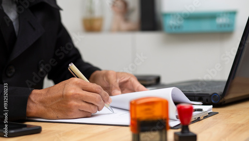 Document sign approve and stamping, business man sign approved document,contract, power of attorney,receipt at workplace