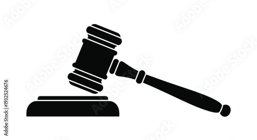 A stark black silhouette of a gavel resting on a sound block symbolizing justice and legal proceedings silhouette
