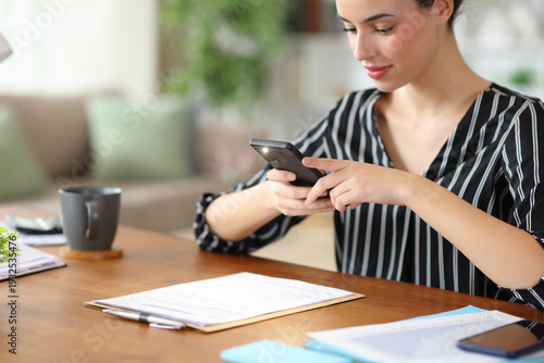 Freelance worker taking photo of form with smart phone