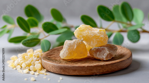 frankincense resin crystals on a rustic wooden plate