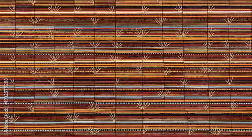 A colorful Yakan weaving fabric from the Philippines, displaying a seamless pattern with detailed designs in warm brown and orange tones, reflecting rich cultural heritage and artisanal craftsmanship.