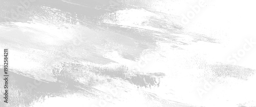 Grey textured brush strokes on white background with subtle dappled effect abstract