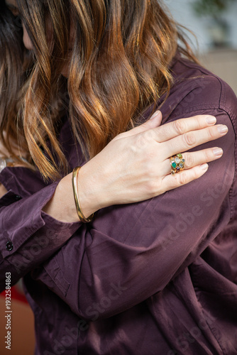 Woman practicing somatic therapy alone to develop introspective self awareness by attending to internal bodily sensations and emotional signals.