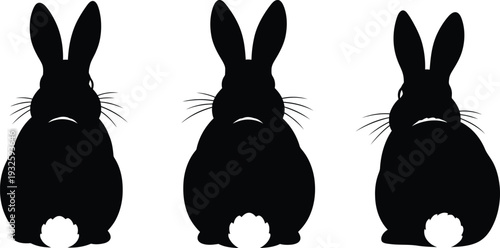 Three black rabbit silhouettes sitting on a white background