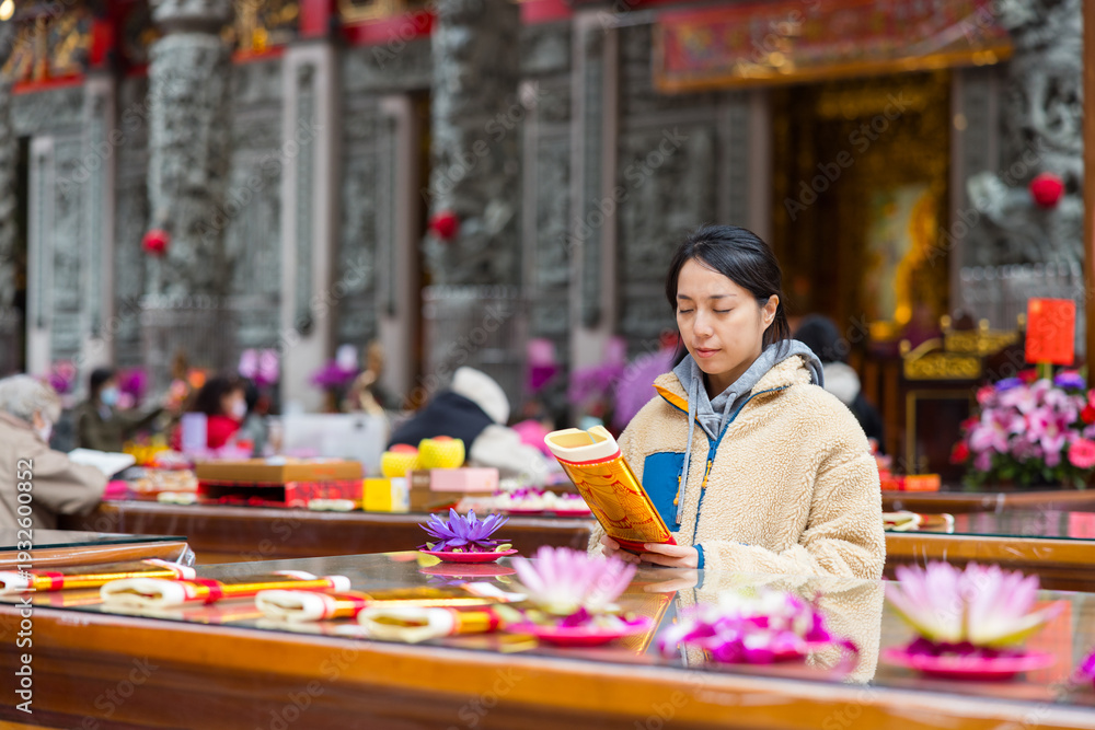 Fototapeta premium Woman performing ritual inside temple hall