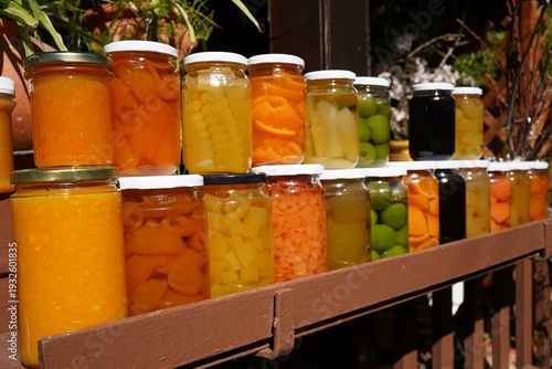 colorful fruit in syrup and jam in glass jars at a traditional village, cyprus