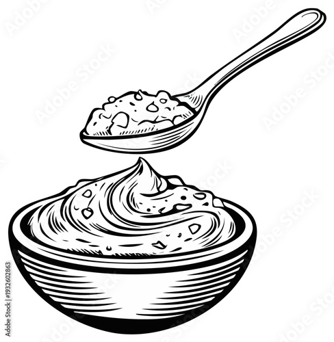 Spoonful of creamy topping with scattered bits over a textured bowl