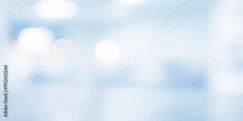 A beautiful abstract blue bokeh background reminiscent of a bright summer sky filled with fluffy white clouds and sunlight