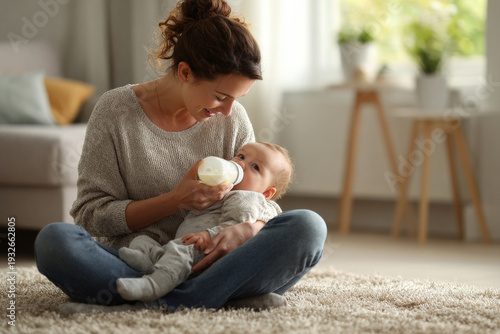 mother bottle feeding baby while sitting on soft carpet in sunlit room, minimalistic modern interior, genuine candid emotion, horizontal composition