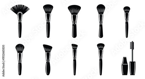 A collection of ten diverse black silhouette makeup brushes and a mascara tube with wand are displayed in two rows on a clean white backdrop.