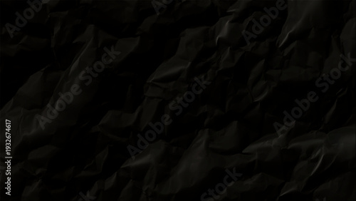Crumpled black paper texture background closeup detail