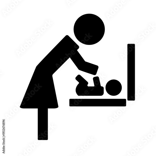 Silhouette of adult changing diaper on baby at changing station