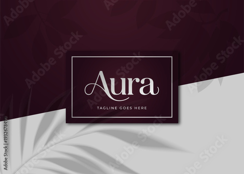 Elegant logo design with the word 'Aura' and placeholder tagline on a sophisticated background.