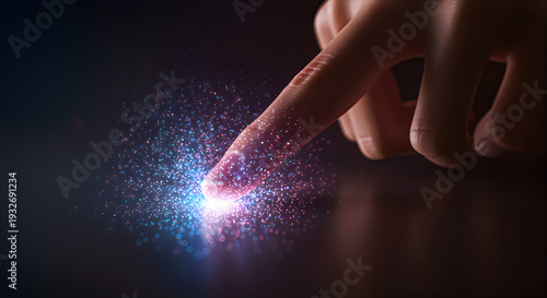 hand touching glowing particles on dark surface