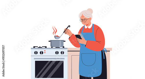 Senior woman in an apron cooking soup on a gas stove while checking a recipe on her smartphone in a modern kitchen.