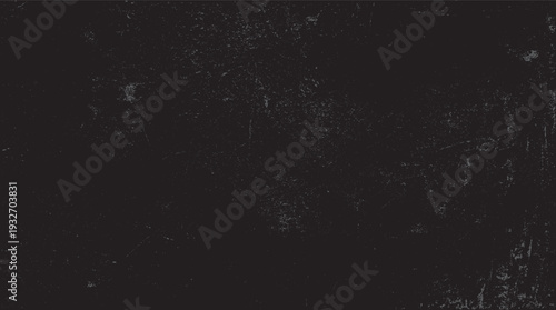 Dark grey textured background with scattered light grey speckles and scratches
