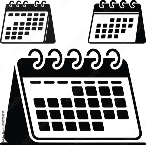 Open desk calendar with marked dates in bold black silhouette representing scheduled appointments and planned tasks concep