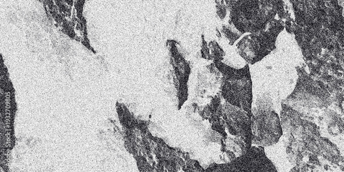Abstract monochrome textured background with irregular light and dark patches and a fine grainy overlay creating a natural stone or marble-like appearance for design