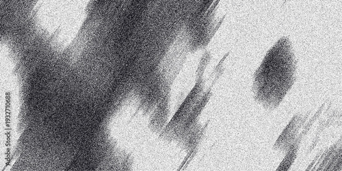 Dynamic grayscale abstract streaks and smudges with a granular texture creating a sense of movement and energy for artistic backgrounds