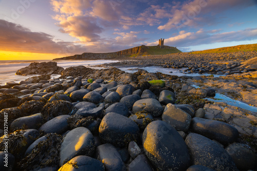 Dunstanburgh Castle on a beautiful summer morning, Northumberland, England, UK.
