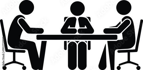 Three people sitting around a table in a business meeting.