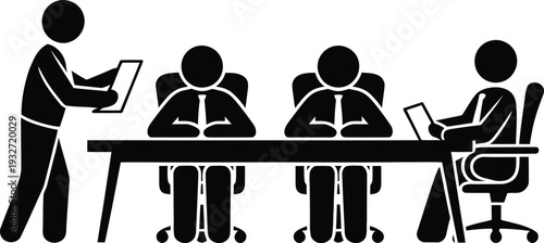 A person presenting to a group of seated individuals in a business meeting setting