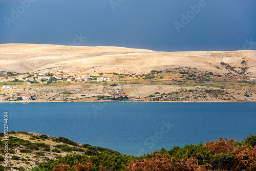 Pag island barren landscape with traditional Croatian village