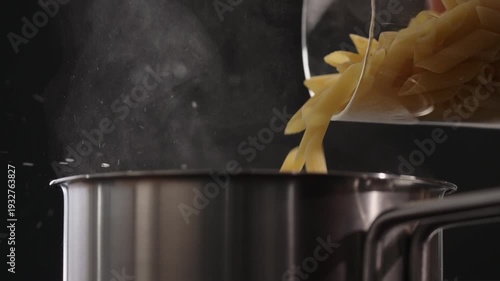 Wallpaper Mural Slow motion dry penne falling into saucepan Torontodigital.ca