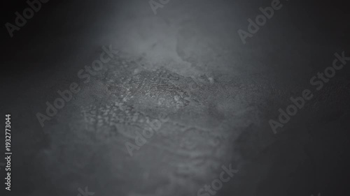 Slow motion handheld shot of gray concrete surface