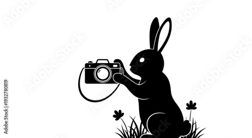 A black silhouette of a rabbit holding a camera