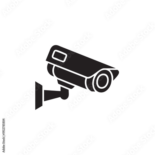A security camera is mounted on a wall, providing surveillance, monitoring the area from a fixed viewpoint, and recording footage effectively.