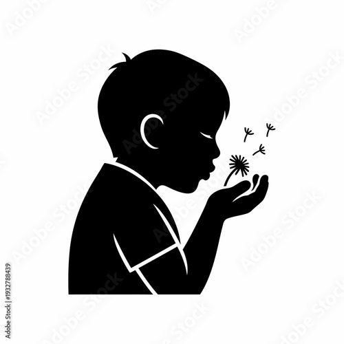 Young Boy Blowing Dandelion Seeds.