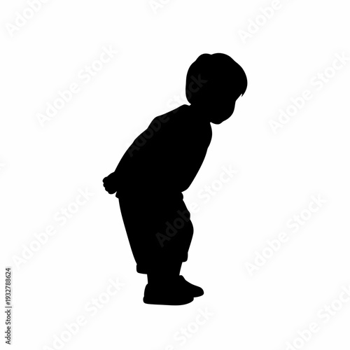 Silhouette of a young child standing.