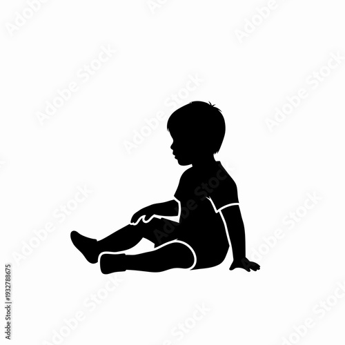 Silhouette of a Sitting Young Child.
