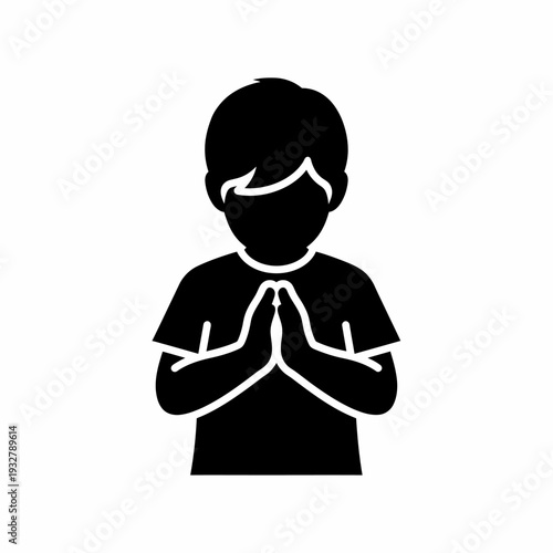 Young Boy Praying with Hands Together.