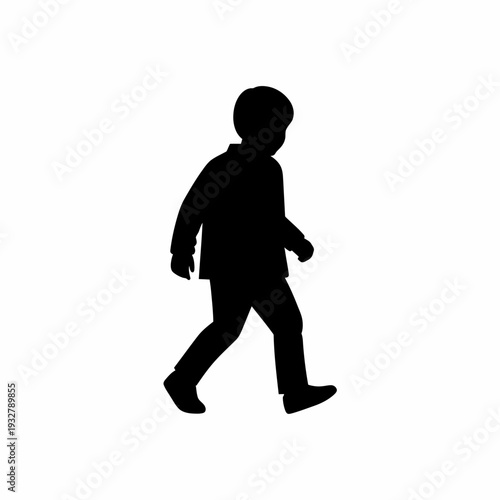 Silhouette of a Walking Young Boy.
