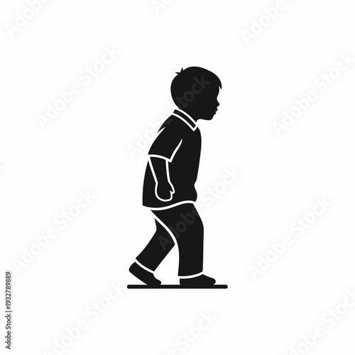 Silhouette of a Young Boy Walking.