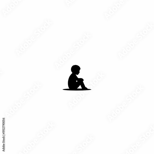 Silhouette of a Sitting Child Alone.