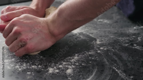 Wallpaper Mural Slow motion man working with dough on concrete countertop Torontodigital.ca