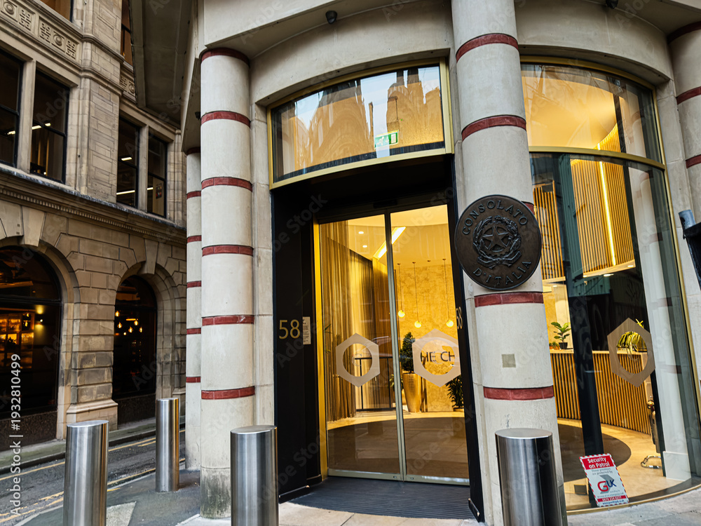 Fototapeta premium Consulate of Italy Manchester entrance facade with glass doors and distinctive columns Manchester UK